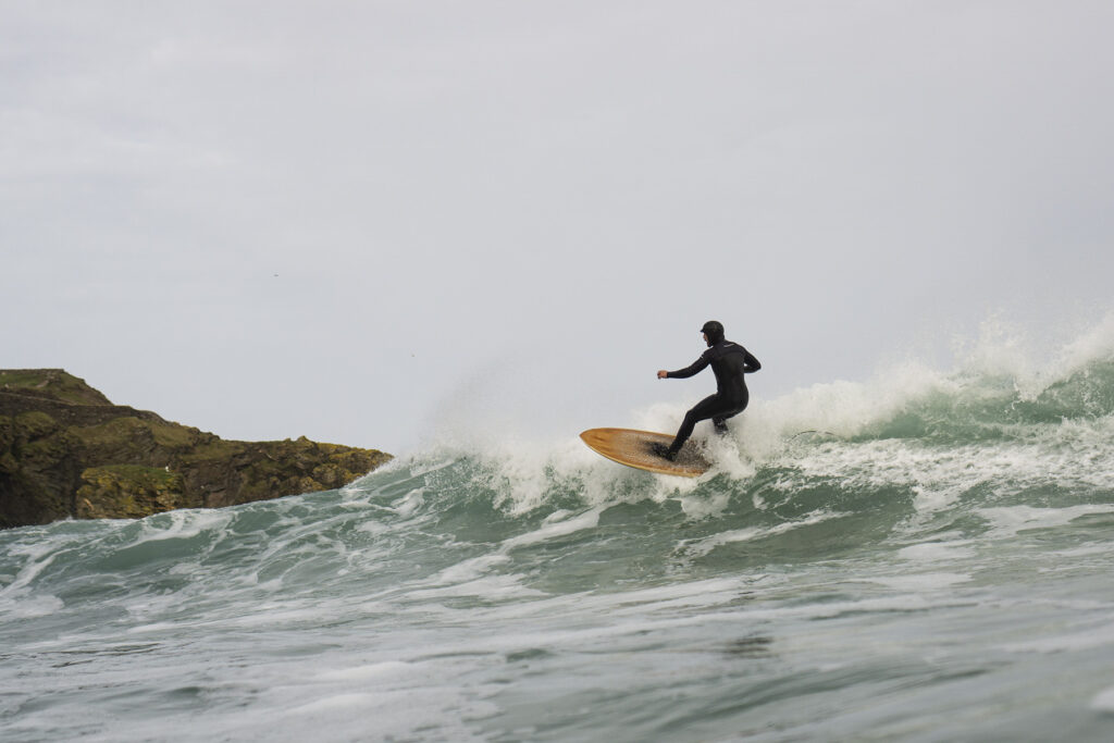 otter wooden surfboards surfer wave turn