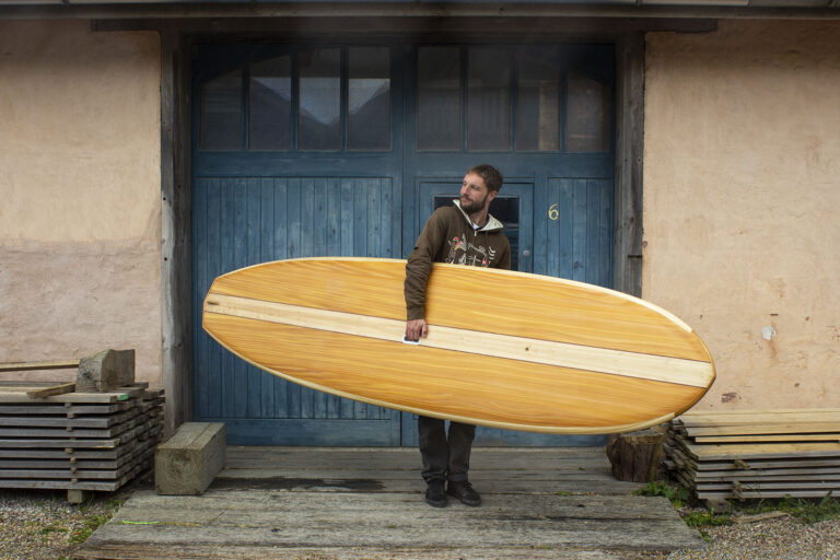 Otter Surfboards Wooden Paddleboard SUP Holding