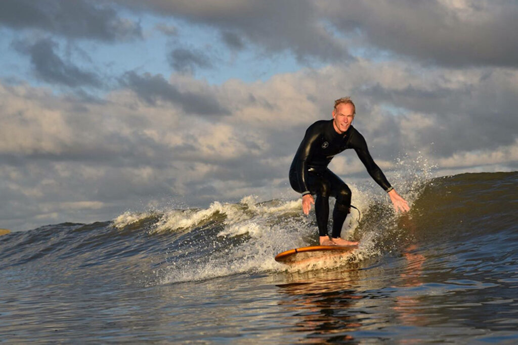 otter wooden surfboards surfer wave smile