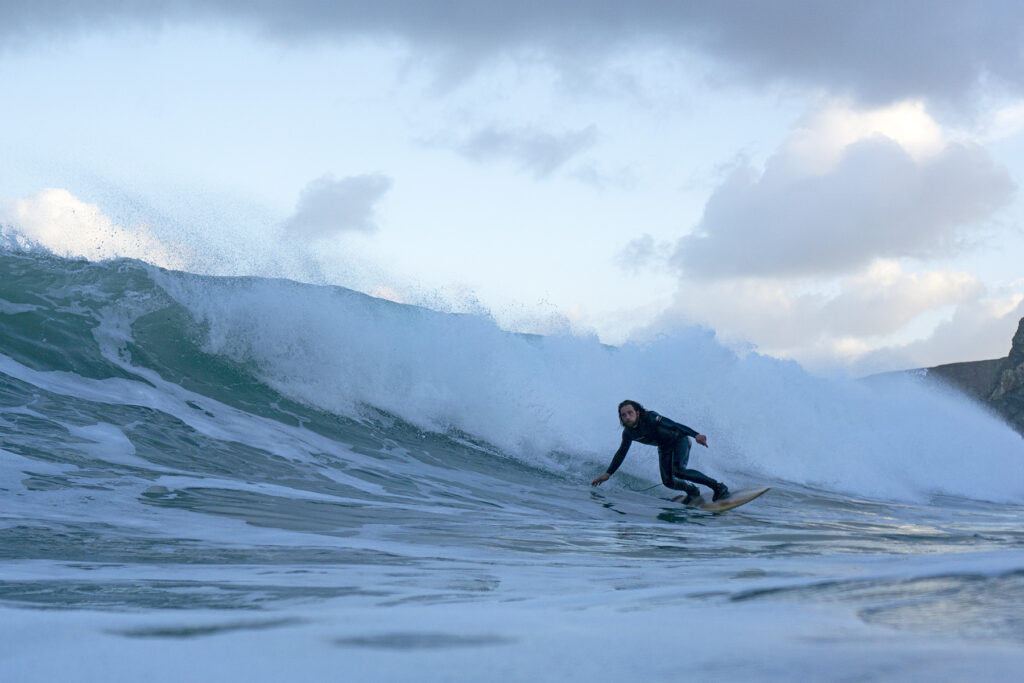 otter wooden surfboards surfer wave bottom turn sustainable