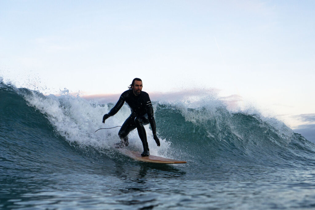otter wooden surfboards sustainable surfer wave