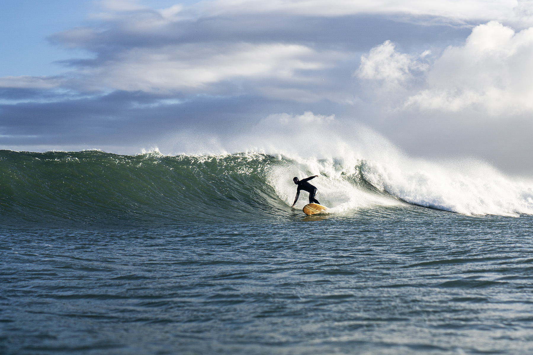 otter surfboards sustainable wooden surfboard surfer wave