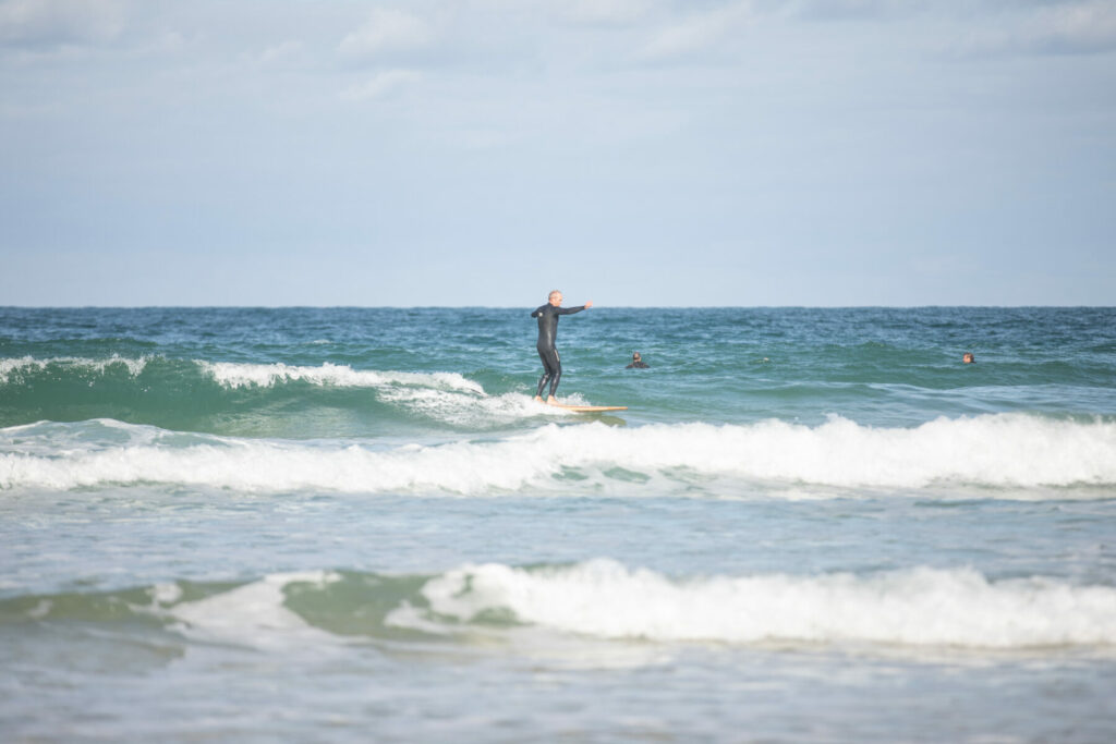 otter sustainable wooden surfboard surfer wave