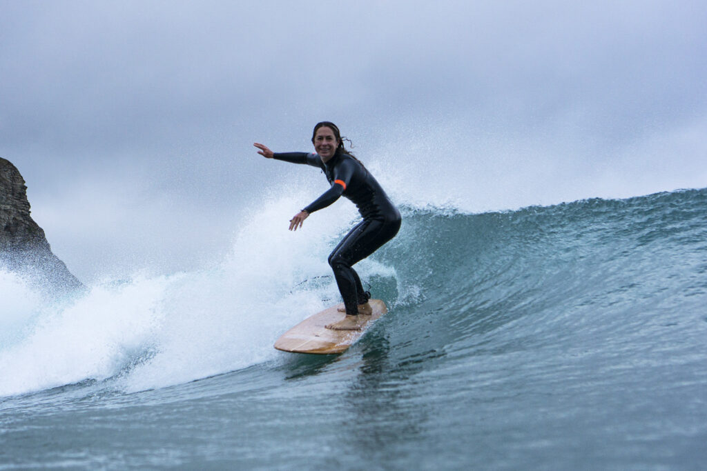 Surfing a hollow wooden surfboard, by Otter Surfboards