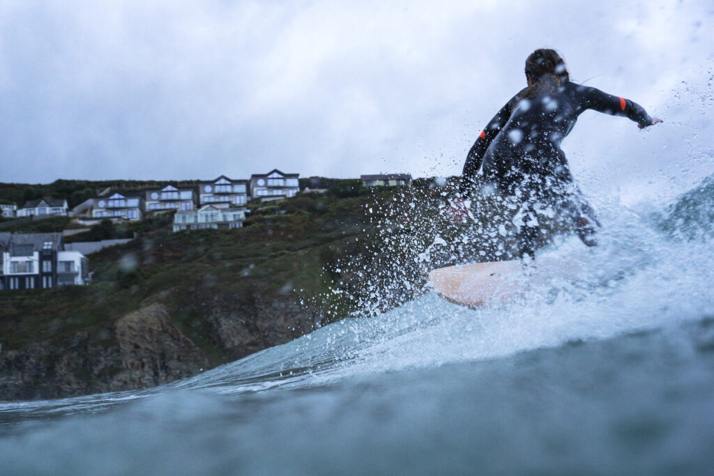Surfing a hollow wooden surfboard, by Otter Surfboards